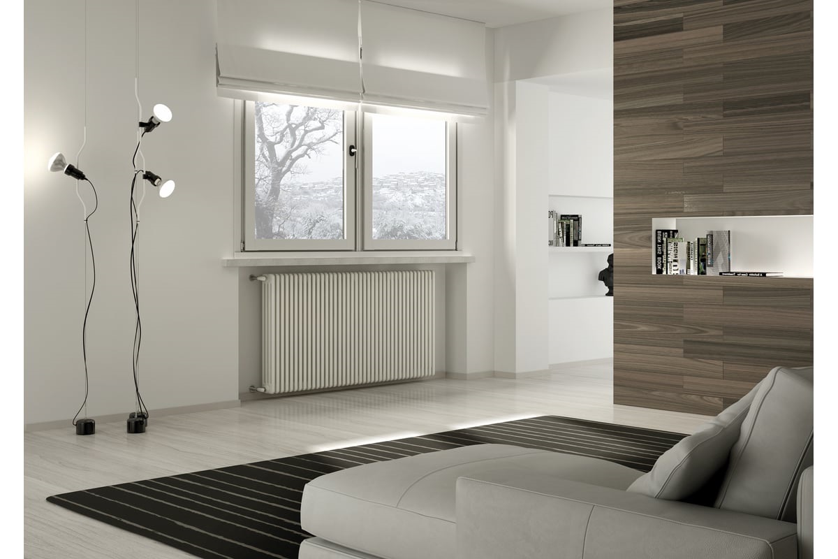 het bed staat verder weg van het raam, tegen een warme muur